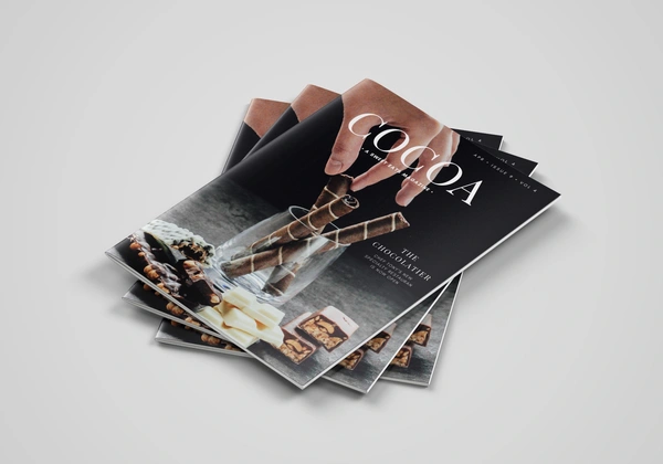 Stack of A4 saddle stitch booklets.